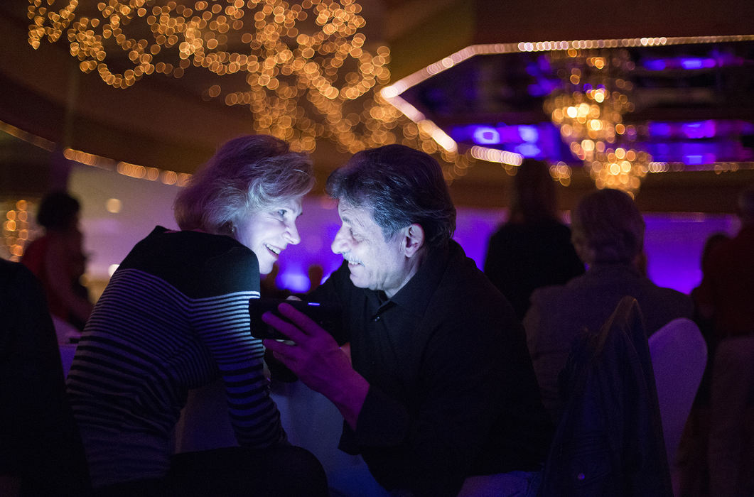 First Place, Chuck Scott Student Photographer of the Year - Andrea Noall / Kent State UniversityLinda Cator and Jerry Villani exchange phone numbers at singles dance in Akron on Sunday, January 31, 2016. The two met while writing down their names for a raffle drawing at the dance. 