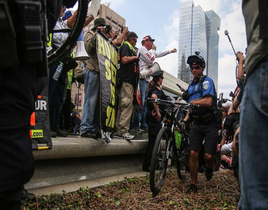 First Place, Chuck Scott Student Photographer of the Year - Andrea Noall / Kent State UniversityAkron Police Officers create a barrier between protest groups outside of the Republican National Convention in Cleveland on Monday, July 18, 2016.
