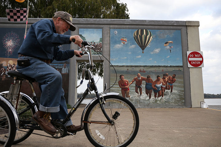 First Place, Chuck Scott Student Photographer of the Year - Andrea Noall / Kent State UniversityA man who goes by the name of Y.M., rides his bike near the Ohio River in Paducah, Kentucky on Tuesday, October 18, 2016. 