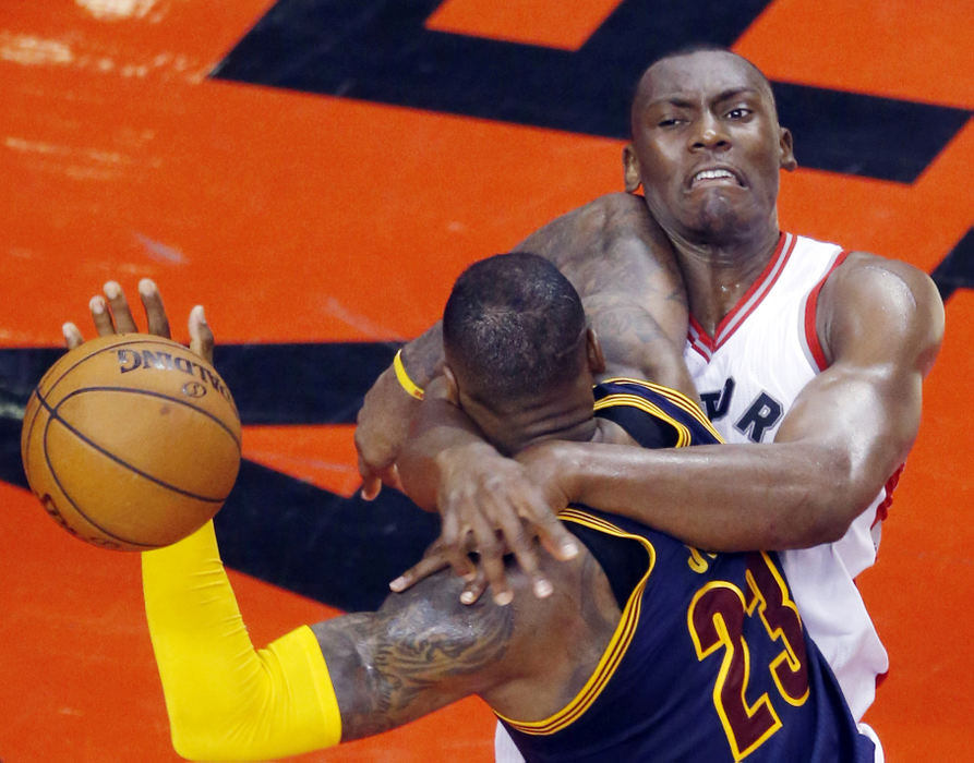 Second Place, Sports Picture Story - Gus Chan / The Plain DealerToronto Raptors center Bismack Biyombo goes high to foul Cleveland Cavaliers forward LeBron James in the NBA Eastern Conference Finals.