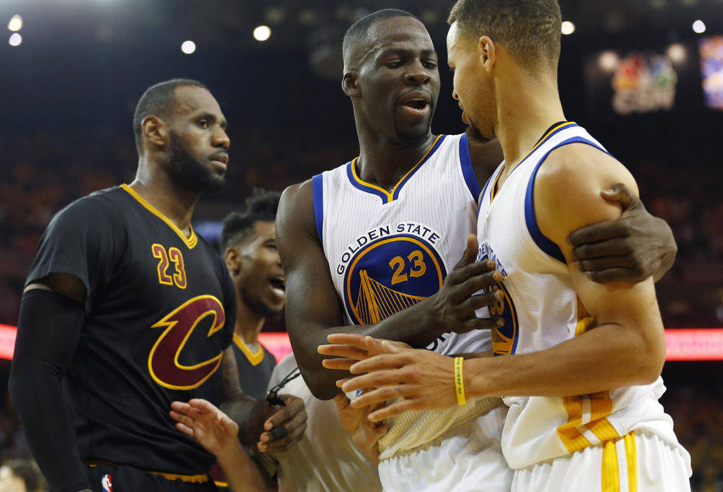 Second Place, Sports Picture Story - Gus Chan / The Plain DealerGolden State Warriors forward Draymond Green separates  guard Stephen Curry from Cleveland Cavaliers forward LeBron James after James blocked Curry's shot.  