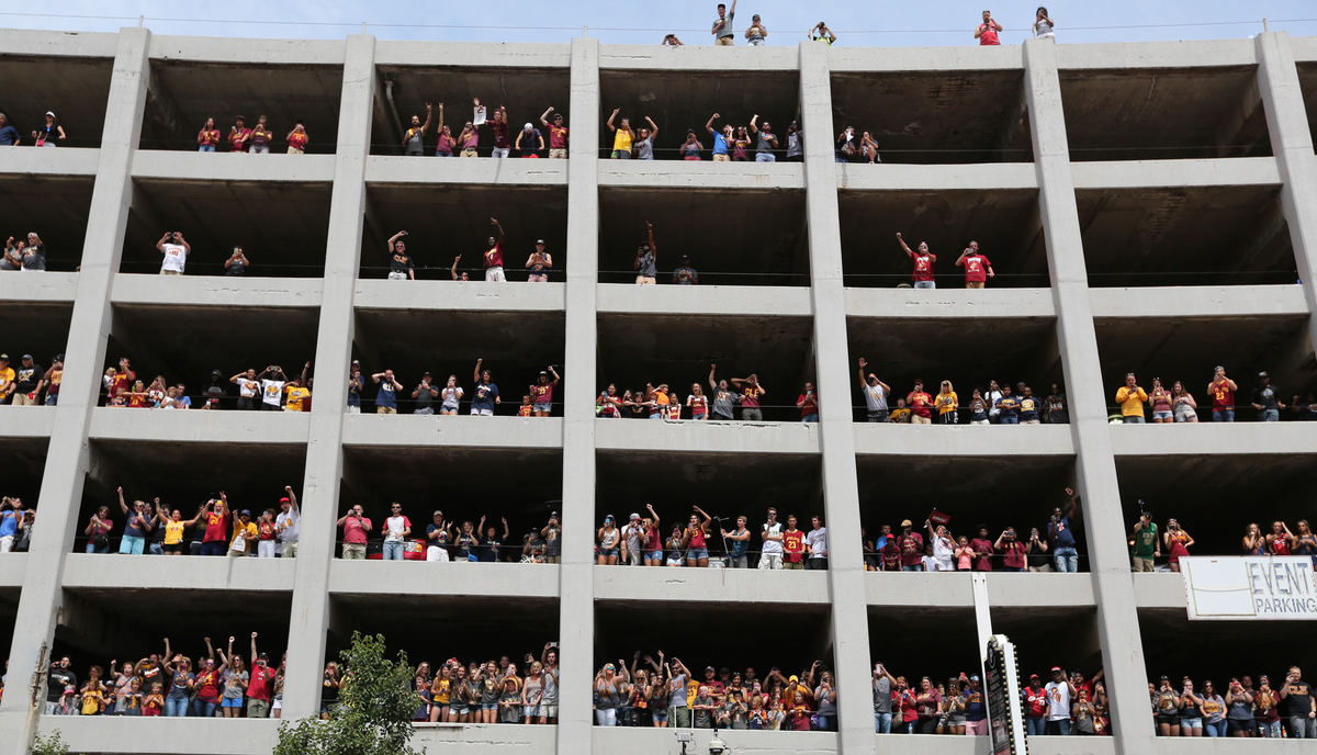 Second Place, Sports Picture Story - Gus Chan / The Plain DealerFans line windows in a parking garage outside of Quicken Loans Arena during the Cleveland Cavaliers victory parade.  
