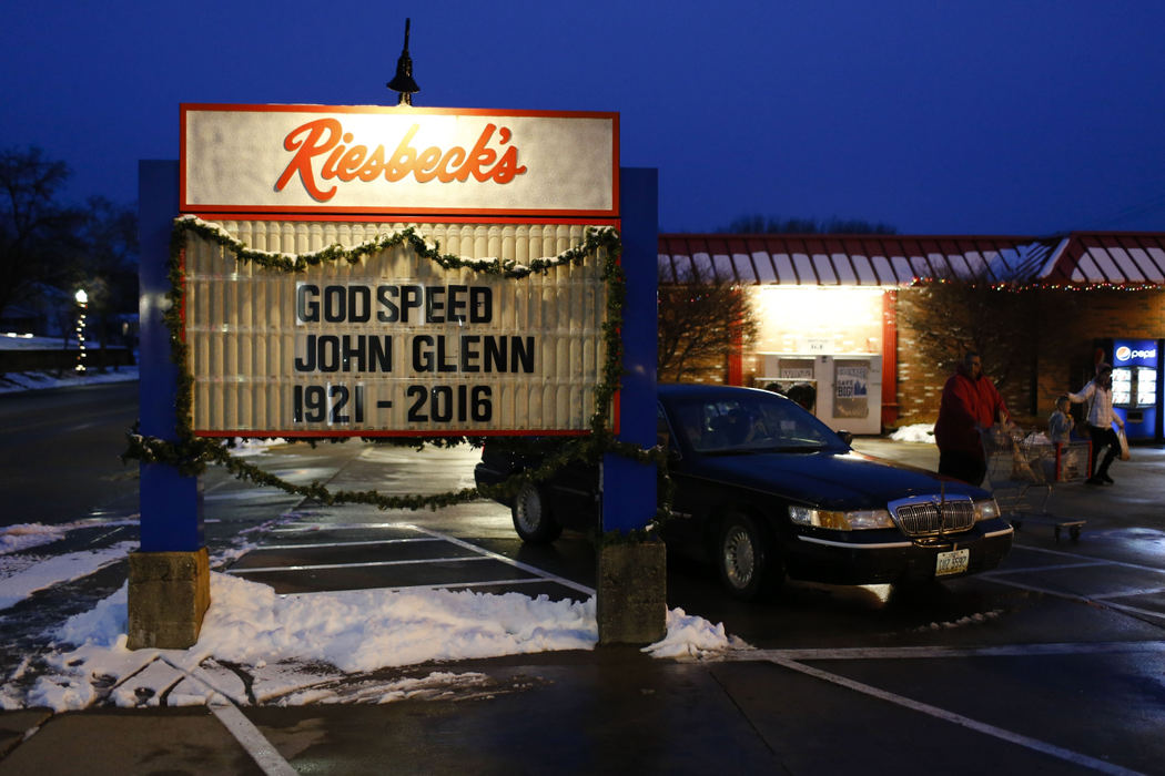 Award of Excellence, Team Picture Story - Joshua A. Bickel / The Columbus DispatchA sign outside Riesbeck's grocery store commemorates the life and death of native son John Glenn before a Memorial Service on Sunday, December 11, 2016 at Westminster Presbyterian Church in New Concord, Ohio. 