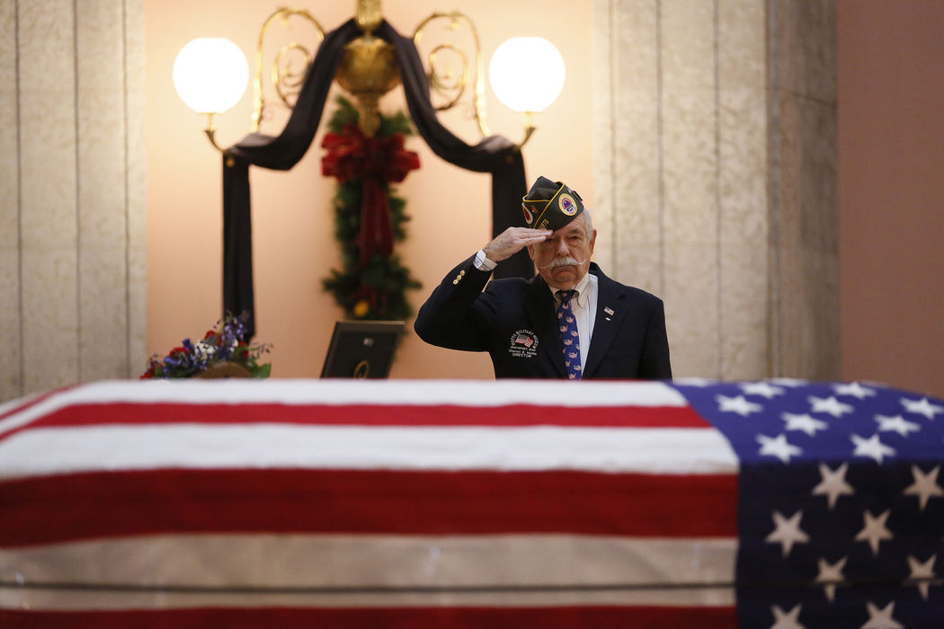 Award of Excellence, Team Picture Story - Adam Cairns / The Columbus DispatchWarren Motts, 76, of Groveport pays his  respects to former astronaut and senator John Glenn as his body lies in honor in the rotunda of the Ohio Statehouse on Dec. 16, 2016. Glenn died on Dec. 8 at the age of 95. 