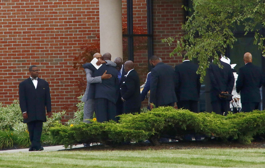 First Place, Team Picture Story - Fred Squillante / The Columbus DispatchMourners stand outside of the First Church of God after the funeral service for Tyre King on Sept. 24, 2016. 
