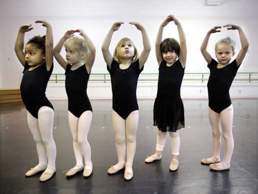 Feature - 3rd place - Five "pre-ballet class" students - from left, Alexa Delarosa, Lucy Tarpy, Avery Forbes, Ann Breninghouse, and Angel DeVor, - strike the perfect pose as they check themselves in a mirror Friday at the Beck Center for the Arts in Lakewood. Melanie Szucs, the center's associate director of dance education, said the girls start to learn confidence through dancing even at a young age. (Lisa DeJong / The Plain Dealer)