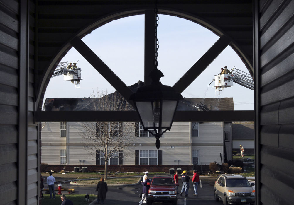 Spot News - 2nd place - Firefighters respond to an multi family apartment complex fire on Hilliard Park Blvd off of Roberts Road in Hilliard. There were no reported injuries. Neighbors knocked on doors to alert the occupants to the fire.  (Neal C. Lauron / The Columbus Dispatch)