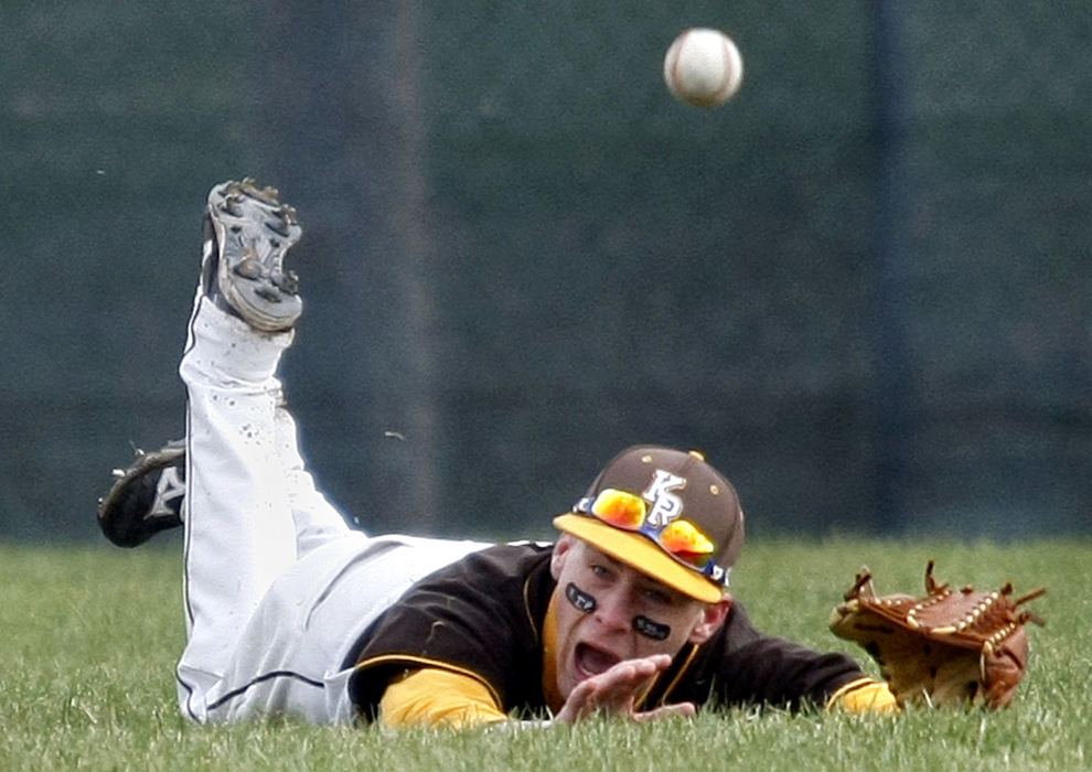 Sports - 2nd place - Jeff Tiffner of Kenton Ridge dives for a fly ball in center field during a game at Bellefontaine. Kenton Ridge won the game 3-2. (Barbara J. Perenic / Springfield News-Sun)