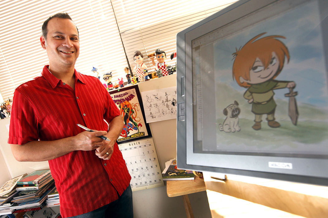 Portrait - 3rd placeCartoonist Rafael Rosado poses in his studio office at Production Partners Media in Lewis Center. At right is the character "Claudette" who is the lead role in Giants Beware!, a graphic novel he has published with writer Jorge Aquirre.   (Jonathan Quilter / The Columbus Dispatch)