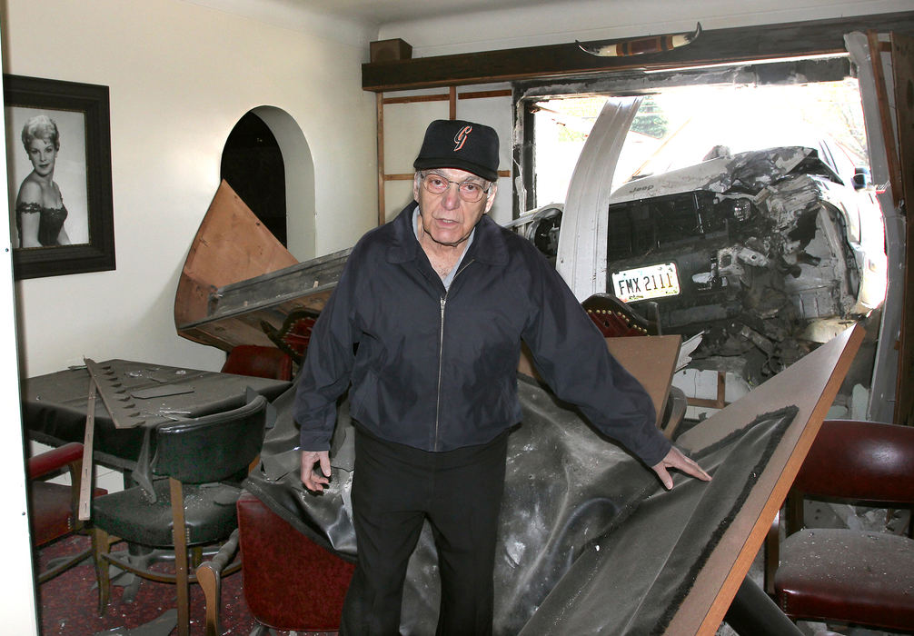 Spot News - 3rd place El Grande Steak House owner Roger Del Prince stands inside his heavily damaged business following a two-vehicle accident Wednesday on West Prospect Road in Saybrook Township. A woman drove her white Jeep Liberty east on West Prospect when she allegedly fell asleep, traveled left of center and struck a west-bound silver Jeep. The Jeep Liberty lost its left front wheel and swerved sharply north crashing into the El Grande Steak House. The restaurant was not open.   (William A. West / Wwest News Service)