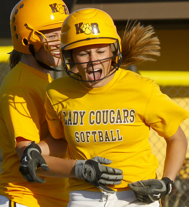 Sports Feature - 2nd placePaige McCrary (27) of Kenton Ridge celebrates with Elyssa Mathews (4) after scoring in the winning run against Northwestern. Kenton Ridge won the game 8-7 in eight innings. (Barbara J. Perenic / Springfield News-Sun)