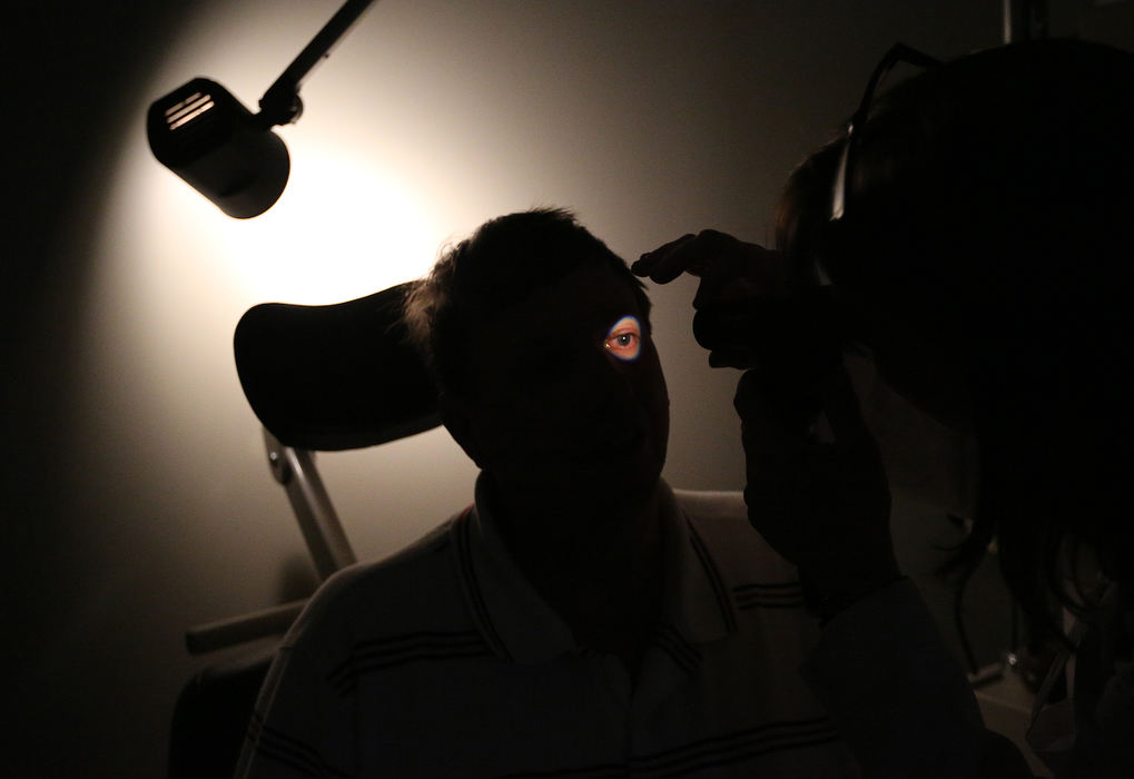 General News - 1st placeDr. Joan Nerderman conducts an eye exam on WIlliam Cameron, at the Faith Mission Outreach Eye Clinic. Cameron has been homeless for several years and relies on the free clinic for assistance with his glaucoma.  (Adam Cairns / The Columbus Dispatch)