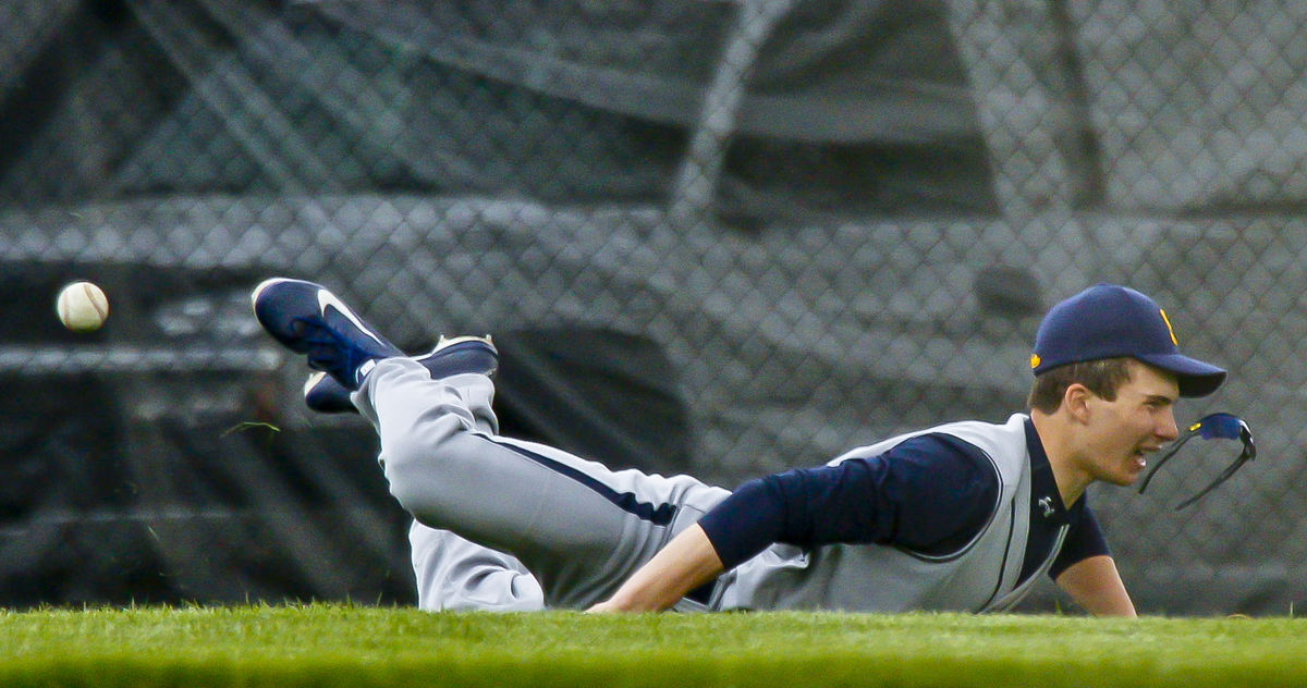 Sports - 2nd placeRyan Prendergast (6) of Springfield loses his sunglasses as he dives to catch a ball in the outfield during a  game at Centerville. (Barbara J. Perenic / Springfield News-Sun)