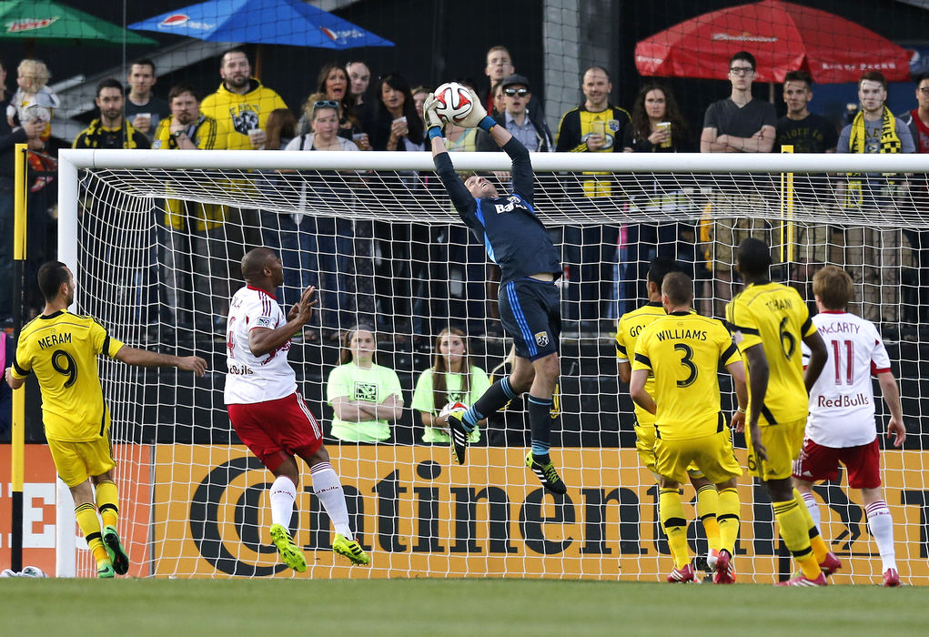 Sports - HM - Columbus Crew goalkeeper Steve Clark (1) leaps to make a stop on a corner kick during the first half of their match against the New York Red Bulls at Columbus Crew Stadium. (Sam Greene / The Columbus Dispatch)