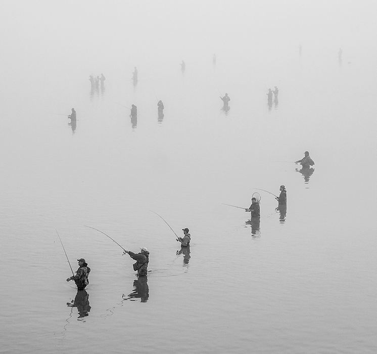 Feature - 2nd place - A fog settles over the Maumee River as fishermen are lined up during the annual spring walleye run in Perrysburg. (Andy Morrison / The (Toledo) Blade)