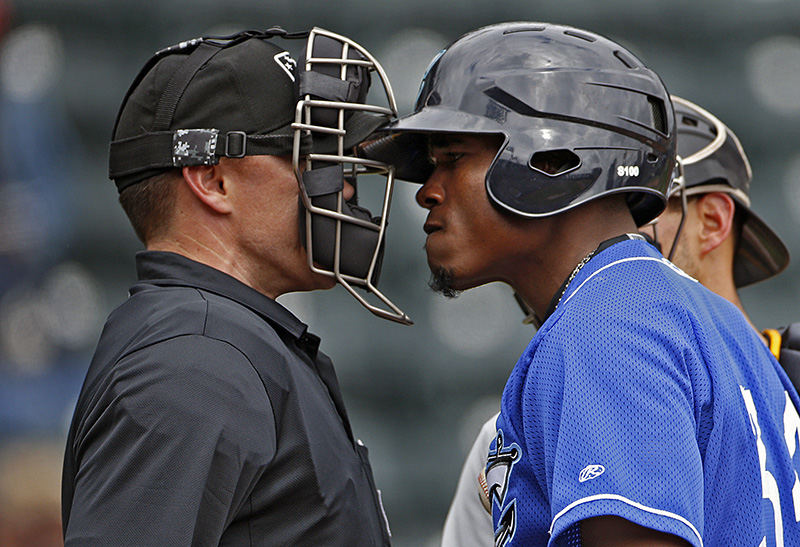 Sports Feature - 1st place - Columbus Clippers right fielder Carlos Moncrief gets into the face of home plate umpire Jon Byrne after a called third strike against Moncrief during their game against Indianapolis Indians at Huntington Park in Columbus.  Moncrief was thrown out of the game.  (Kyle Robertson / The Columbus Dispatch)