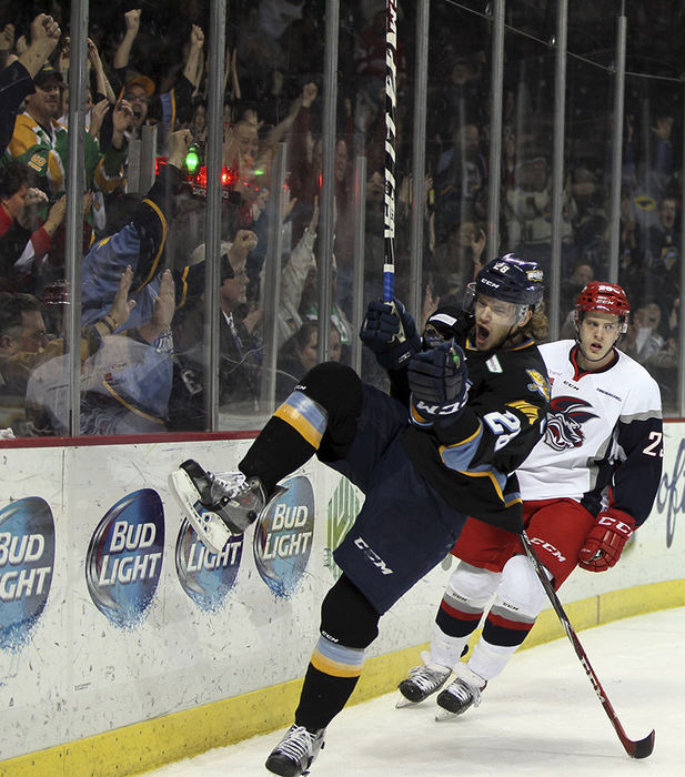    Sports Feature - 3rd place - Walleye forward Kyle Bonis (28) celebrates scoring his second goal of the game against  Elmira goalie Sam Marotta (39)  during an ECHL hockey game at the Huntington Center in Toledo. (Jeremy Wadsworth / The (Toledo) Blade)