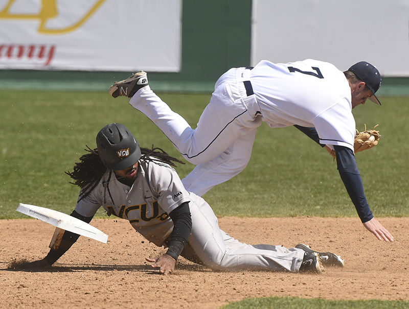 Sports - HM - VCU's Logan Farrar upends the second base bag along with Dayton's Greg Rhude during an unsuccessful stolen base attempt.  (Erik Schelkun / Elsestar Images )