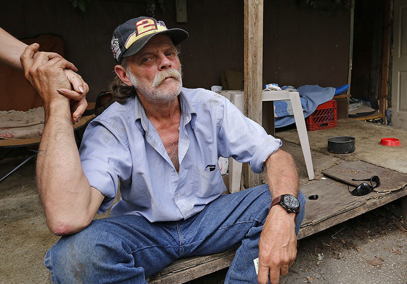 Portrait - 1st place - Going by the name "Cowboy" this homeless man living on an abandoned portion of Whittier Street agreed to share his memories of a murdered friend as long as she wasn't portrayed as a bad person, "because she wasn't." (Chris Russell / The Columbus Dispatch)