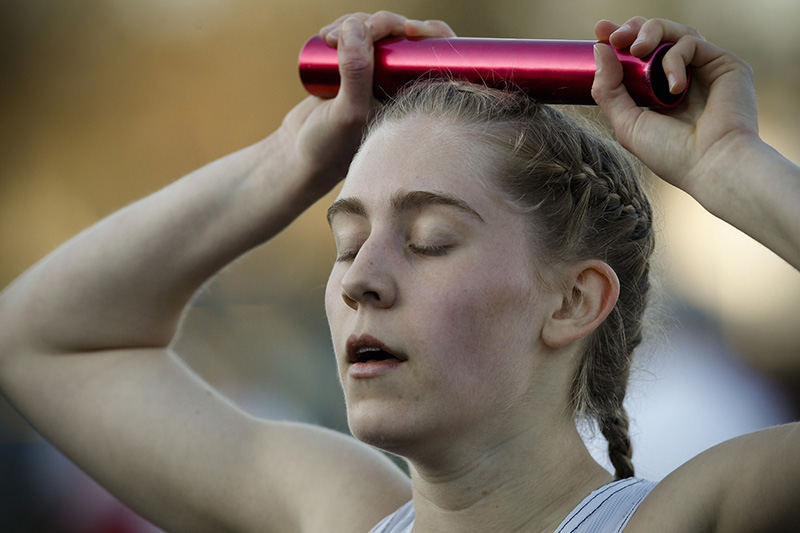 SPSports Feature - 1st place - Columbus School for Girls's Eleanor Smith rests after finishing the girls 4x400 meter relay during the Russ Owen Bexley Relays at Bexley High School. (Joshua A. Bickel/ThisWeek Community News) (Joshua A. Bickel / ThisWeek Community News)