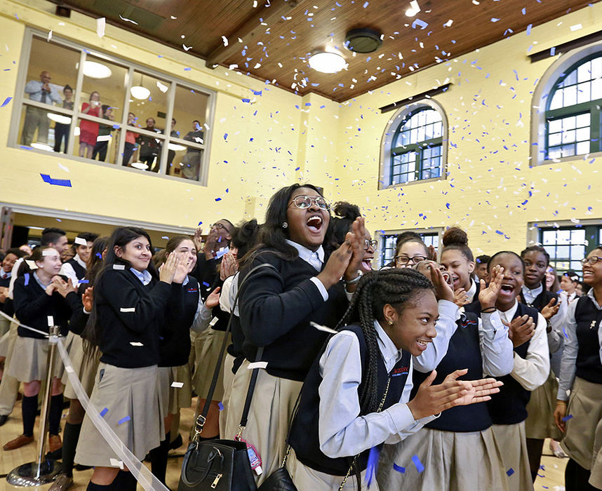 General News - 1st place - Underclassmen react as a confetti cannon fires during an event celebrating graduating seniors at Cristo Rey High School in Columbus.  The Cristo Rey Columbus H.S. Class of 2017, the very first graduating class for the private Catholic school for low-income students, just announced that it has a 100 percent acceptance rate to college. (Barbara J. Perenic / The Columbus Dispatch)