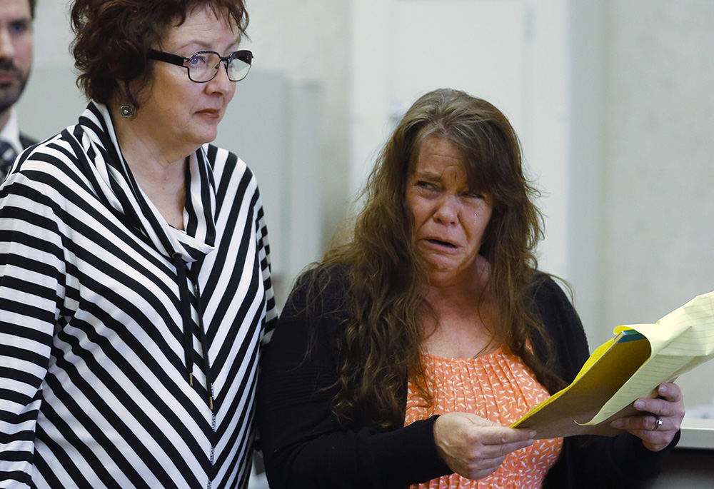 General News - 3rd place - A tearful Bonnie Ignasiak (right) speaks to the court as Lynn Carder, director of the Toledo-​Lucas County Victim-Witness Assistance Program, stands by her side, during the sentencing of Adam Akers by Judge Myron Duhart. Akers was convicted and sentenced for the murder of her mother, 72-year-old Judith Uyttenhove.  (Andy Morrison / The Blade)