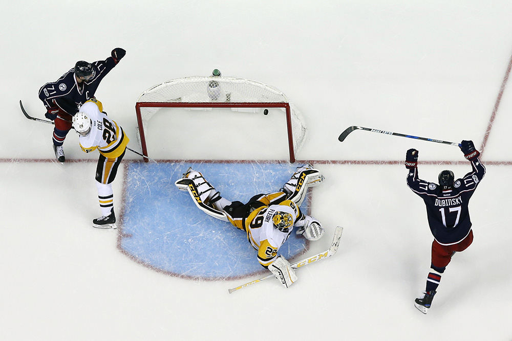 Story - 2nd place - Columbus Blue Jackets center Brandon Dubinsky (17) reacts after scoring a goal on Pittsburgh Penguins goalie Marc-Andre Fleury (29) to tie the game 4-4 during the third period of Game 3 of the Stanley Cup first round playoff game at Nationwide Arena in Columbus.  (Kyle Robertson / The Columbus Dispatch)