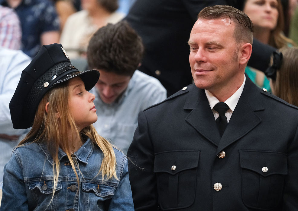 General News - 2nd placePrivate Sean Beavers sits with his daughter Elise Beavers during The Toledo Fire & Rescue Department Awards & Recognition Ceremony at St. Clements Hall in Toledo. Mr. Beavers was honored along with others in his unit with the Distinguished Unit Citation for actions at a structure fire at 3950 Airport Highway in February of last year. (Jeremy Wadsworth/The Blade)