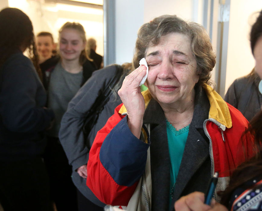 General News - 3rd placeAngie Darnell wipes a tear of joy after a plaque in memory of her late husband Captain Jack Darnell was hung during an open house for the refurbished Massillon Fire Station #3. The station will go back into service after being closed since May of 2012. Jack Darnell investigated the LaCusina Fire.  (Scott Heckel/The Canton Repository)