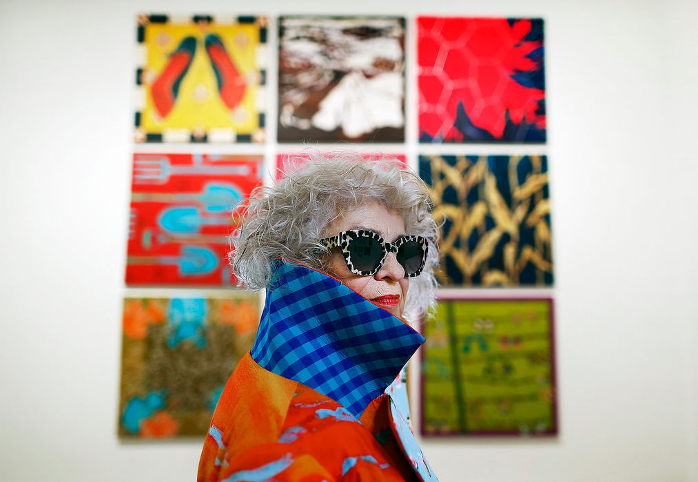 Portrait - 1st placeAt age 74, graduating CCAD student Susanne Dotson poses for a photo in front of her art work at CCAD Beeler Gallery in Columbus. Susanne will graduate with a Masters of Fine Arts from CCAD in May, and this month, her quilt-like paintings that are meant to mix farm and fashion are on exhibit at Beeler Gallery.  (Kyle Robertson/The Columbus Dispatch)