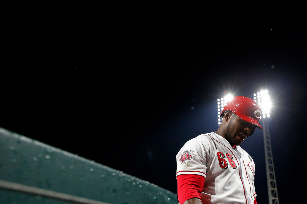 Sports Feature - HMCincinnati Reds right fielder Yasiel Puig (66) returns to the dugout after lining out in the eighth inning against the Atlanta Braves at Great American Ball Park in Cincinnati. After a long rain delay, the Reds held on to win 4-2. (Sam Greene/The Cincinnati Enquirer)