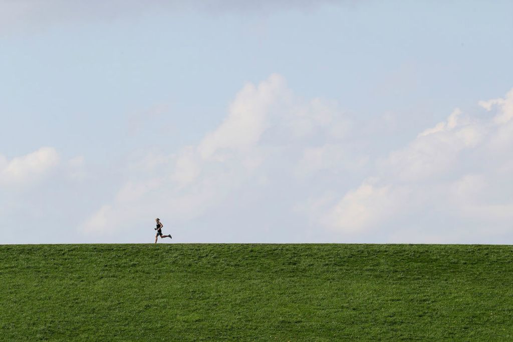 Feature - 2nd place - A runner makes his way across a walking path near the Alum Creek Dam in Westerville. Shane Flanigan / ThisWeek Community News