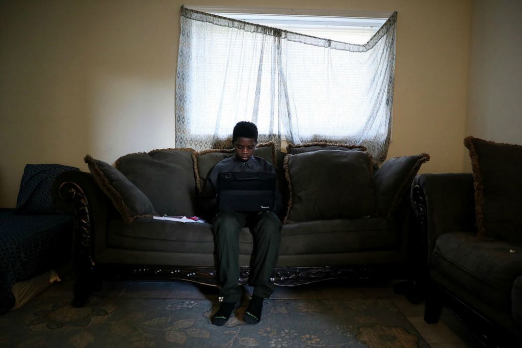 General News - 3rd place - Tene Ba, a seventh-grade student at Winton Woods Middle School, reviews his English lessons in Forest Park, Ohio. Tene was born in Baltimore, Maryland, but spent five years in Mauritania where he learned French as his first language. An English Language Learner, Ba faces barriers trying to keep up with daily assignments. Kareem Elgazzar / The Cincinnati Enquirer