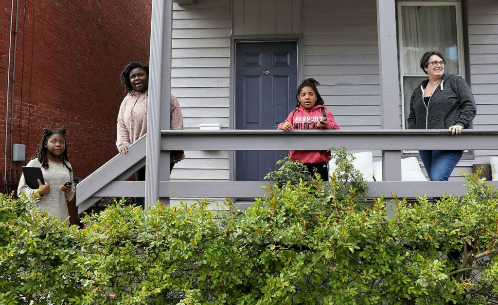 General News - HM - From left: Haddasha Revely-Curtin, 12, Christy Revely-Curtin, 13, Zionnah Revely-Curtin, 7, and Rose Curtin, spot a neighborhood on Columbia Street in Newport Ky. Haddasha has been struggling to read on her own since schools closed due to the new coronavirus pandemic. "Like, I’m just afraid that the coronavirus is going to get all over the street in Covington and Cincinnati, and I don’t know what to do.” Kareem Elgazzar / The Cincinnati Enquirer