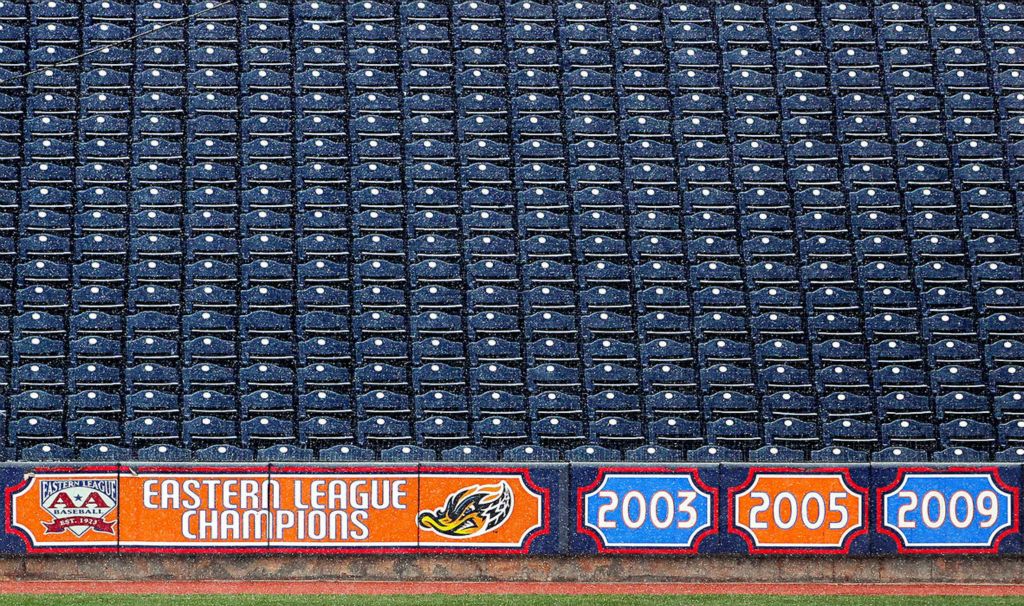 Sports Feature - 3rd place - Seats along the first baseline at Canal Park remain empty as the Akron RubberDucks elected to have a virtual Opening Day due to the coronavirus pandemic in Akron. Jeff Lange / Akron Beacon Journal