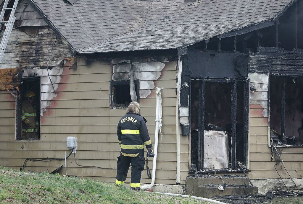 Spot News - HM - The Clark County Coroner's Office investigates a fatal fire in the 500 block of Chestnut Street in Springfield. One person was killed and four people were transported to Springfield Regional with non-life threatening injuries. The fire was called in at 7 am by a Clark County Sheriff's deputy on his way to work. At least one dog was also killed in the blaze.  Bill Lackey / Springfield News-Sun