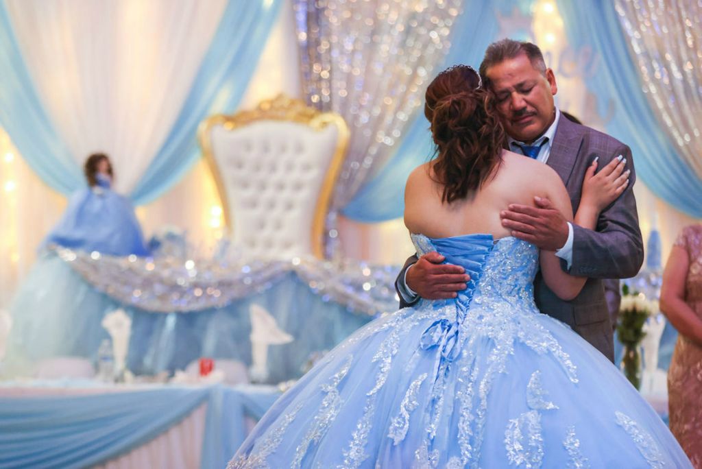 General News - 1st place - Leovardo Martinez holds his daughter Ariana Martinez as they dance during her quinceañera at St. Clement’s Hall in Toledo. A quinceañera is a celebration of a girl transitioning from girlhood to womanhood on her 15th birthday. The Martinez triplets are officially 16 years old, but due to the coronavirus pandemic the family decided to push the celebration back a year.  (Rebecca Benson / The Blade)