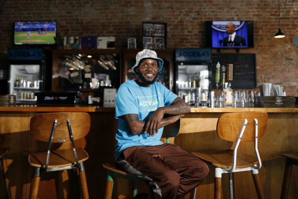 Portrait - HM - Karrio Ballard poses for a photo in his restaurant, Addella's on Oak. Opening a new restaurant during the pandemic has been a struggle.   (Kyle Robertson / The Columbus Dispatch)