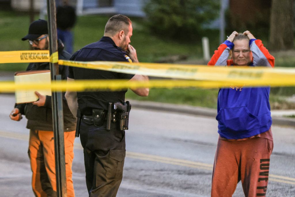 Spot News - HM - A woman reacts after talking to police about a double shooting at 3115 Upton Avenue in Toledo.   (Jeremy Wadsworth / The Blade)