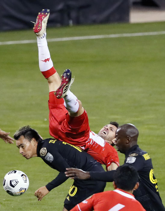 Sports - 2nd place - Columbus Crew SC midfielder Lucas Zelarayan (10) fouls  Real Estelí FC defender Bronzatti (15) during the second half of their CONCACAF Champions League quarterfinals game at Crew Stadium. (Kyle Robertson / The Columbus Dispatch)