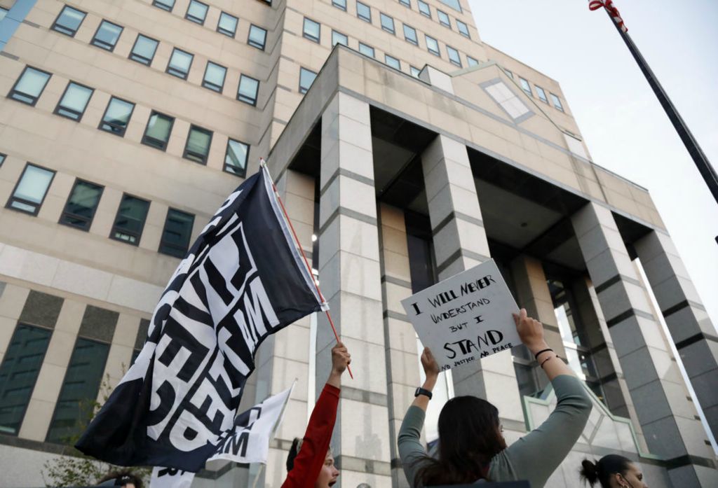 Story - 2nd place - A demonstration takes place out in front of Columbus Division of Police building. Miles Jackson was shot and killed inside Mount Carmel in Westerville by police on Monday. Well over 100 demonstrators took to the street.  (Kyle Robertson / The Columbus Dispatch)