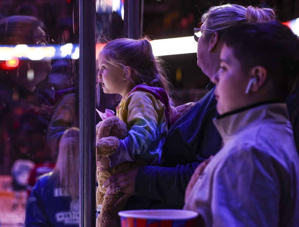 Sports Feature - 1st place - Jerzee Metzler, 3, of Northwood puts her nose the glass as the Toledo Walleye take on Kalamazoo during the first period of an ECHL hockey game at the Huntington Center in Toledo.   (Jeremy Wadsworth / The Blade)