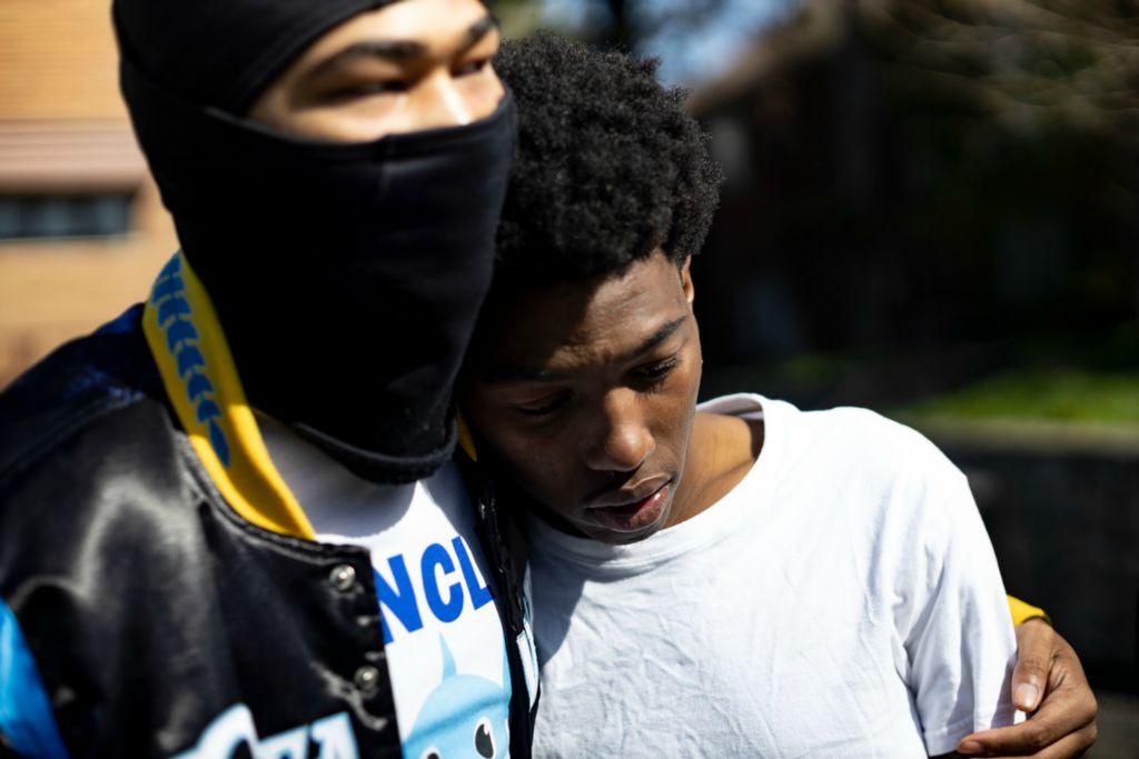 Spot News - 2nd place - Jeremiah Hughes, 20, of Toledo is comforted by his brother Deon Brown, 20, after the death of Hughes’s daughter, Desire Hughes, seven months old, who was shot in Hughes’s car in Toledo on Thursday April 28, 2022.  (Stephen Zenner / The Blade)