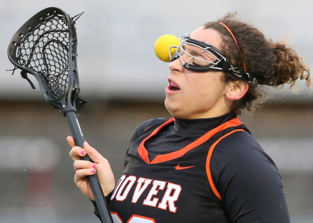 Sports - 1st place - Gabby Michailides of Hoover has the ball bounce off her head during their game at Lake High School. She was not injured on the play. (Scott Heckel / The Canton Repository)