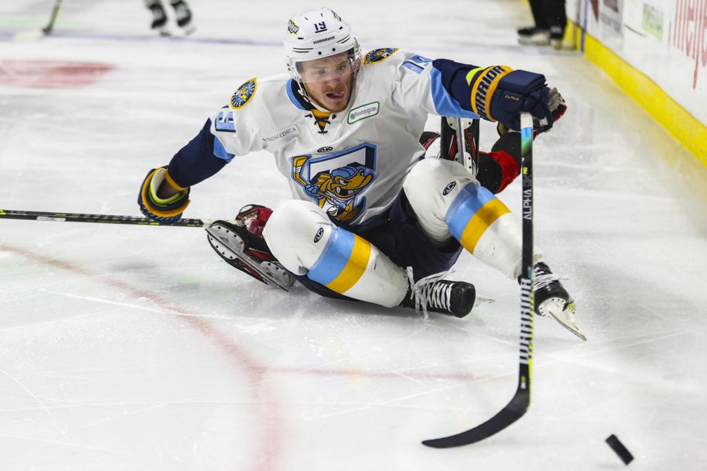 Sports - 2nd place - Toledo’s Matt Berry sticks his tongue out as he reaches for the puck during the third period of an ECHL Central Division semifinal hockey game at the Huntington Center in downtown Toledo. (Rebecca Benson / The Blade)