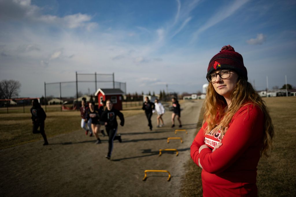 Story - 2nd place - Lauren Cervetto, 28, of Toledo, coaches Stritch lifts, a general fitness class at Cardinal Stritch Catholic High School. Cervetto is the Head coach for cross country, indoor track, track and field and Stritch lifts. (Stephen Zenner / The Blade)