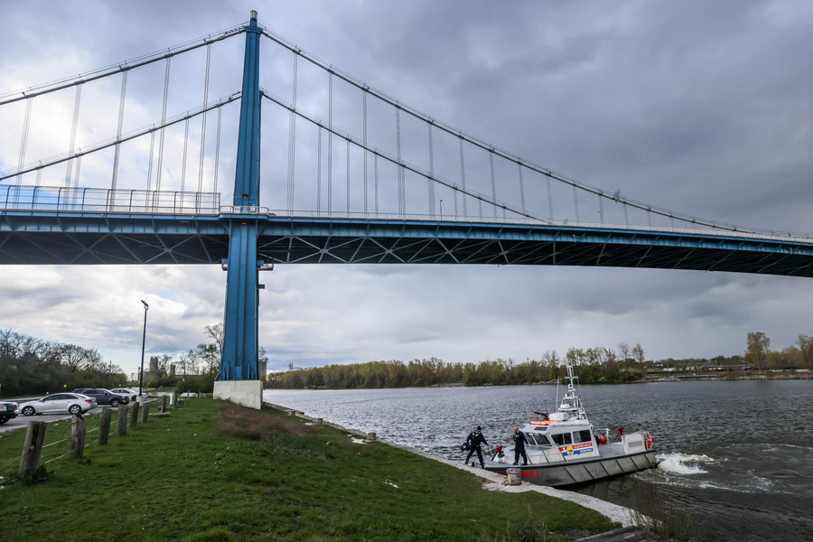 Spot News - 3rd place - A storm rolls in while Marine 1 adds a crew member as a search for a missing person continues in the Maumee River in Toledo.  (Isaac Ritchey / The Blade)