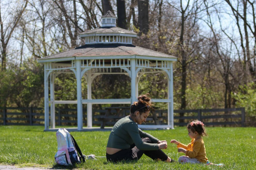 Feature - 3rd place - Jadyn White and her three-year-old daughter Melanie Gonzales play together outside in Toledo.  (Jonathan Aguilar / The Blade)