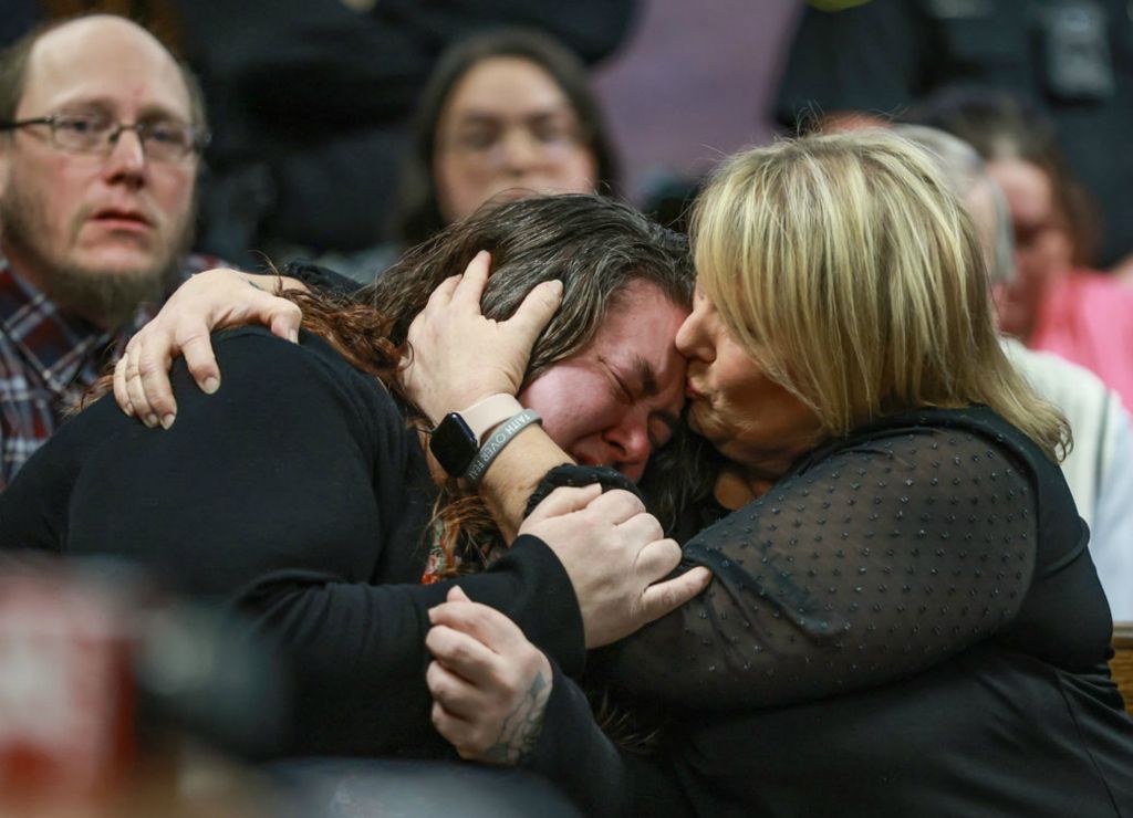 General News - 3rd place - At left Raquel Smouthers, aunt of the two children who were killed when a car driven by Marshella Chidester plowed into the Swan Boat Club, is comforted after speaking during Chidester’s  arraignment at the Monroe County Courthouse in Monroe, Michigan.  (Jeremy Wadsworth / The Blade)