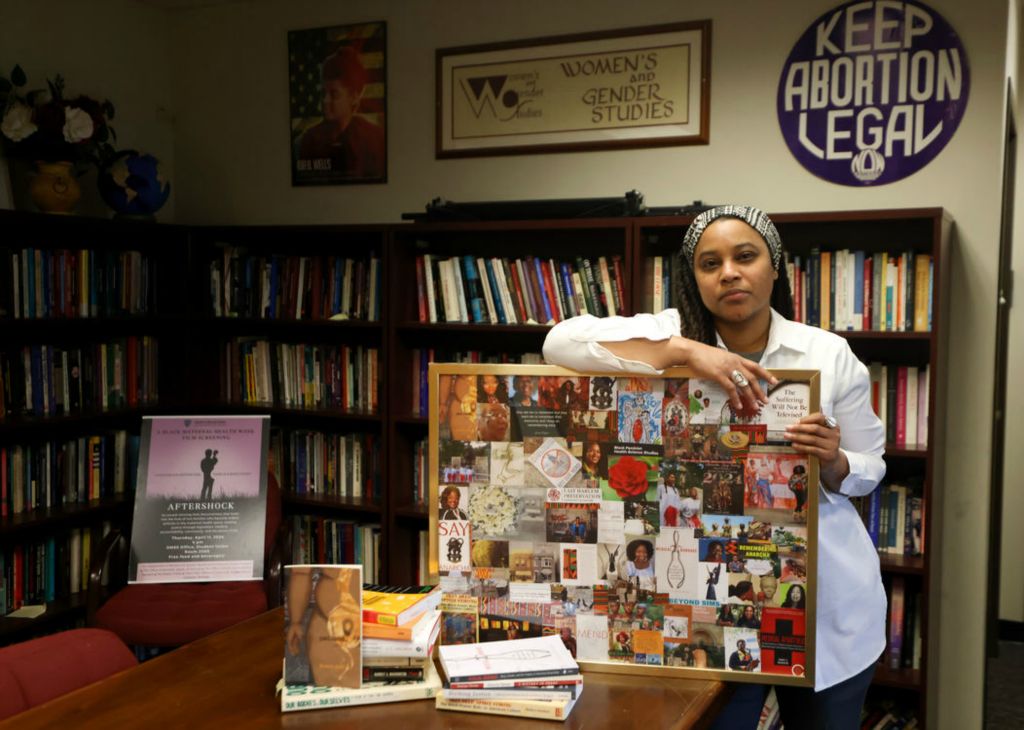 Portrait - 2nd place - Rachel Dudley, an assistant professor in women's and gender studies at the University of Toledo, poses for a portrait at University Hall. Dudley studies the exploitation of enslaved women in the development of modern gynecology.  (Kurt Steiss / The Blade)